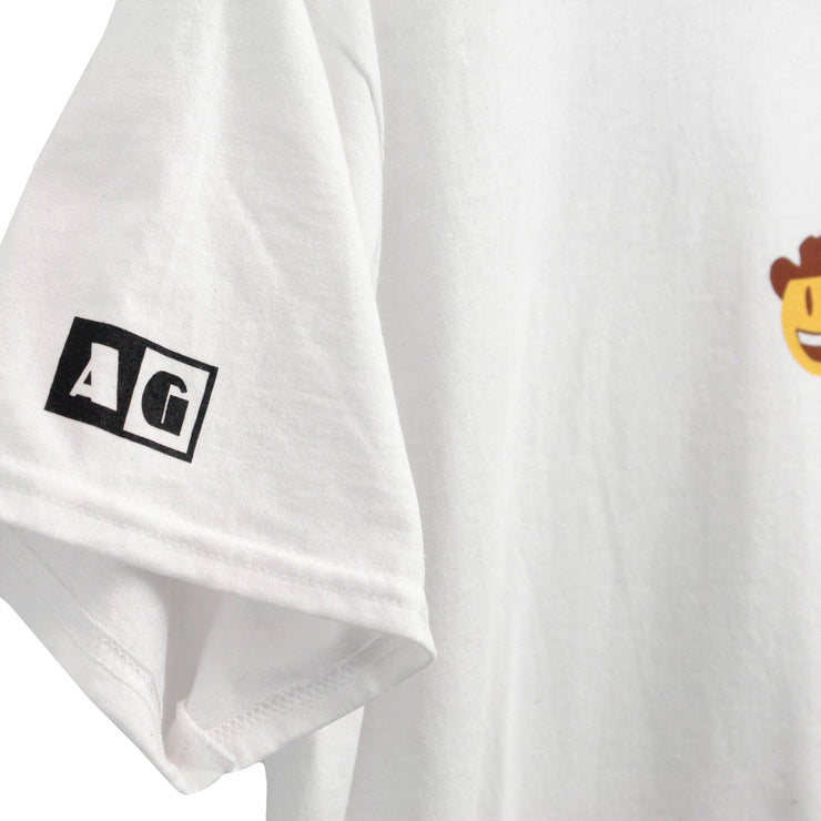 Close up photo of the "AG" text block on the right sleeve of a white tee shirt.  Visible on the far right of the photo is part of the yellow, brown, white cowboy emoji in the center of the tee.