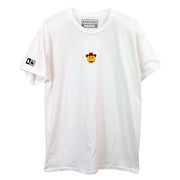 Photo of a white tee with embroidered yellow, brown and white smiley face with a cowboy hat.  On the right sleeve is black "AG" screen printed.  Visible is the "Antonio Garza" inside printed neck tag in gray ink.