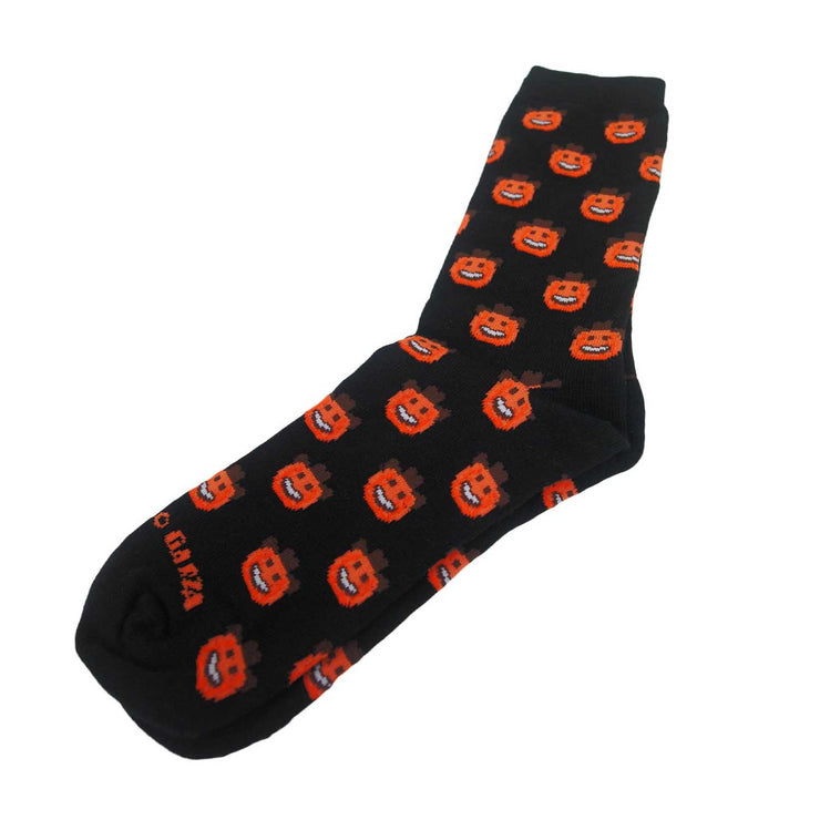 Photo of a  black shin length sock with orange pumpkin smiley faces wearing brown cowboy hats on a white background.  it reads "Garza" at the bottom toe area.