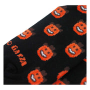 Close up photo of black socks with orange pumpkin smiley emoji with a brown cowboy hat, on a white background.  near the toe it reads "o Garza".